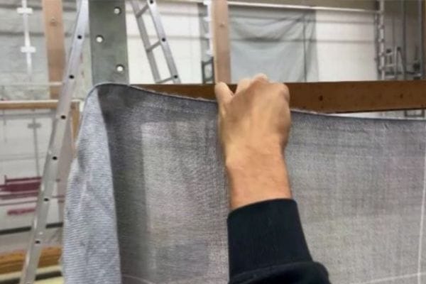 stretching fabric on a tufting frame
